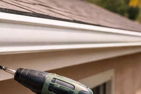 Seamless gutter installation on home